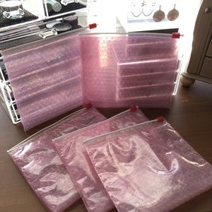 Glossier pink pouches